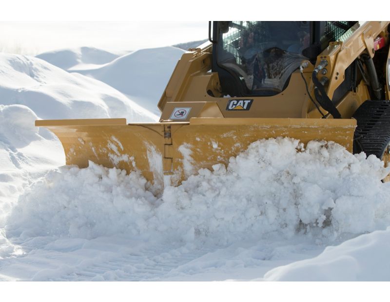 Cat V-Plow Cutting Through Snow