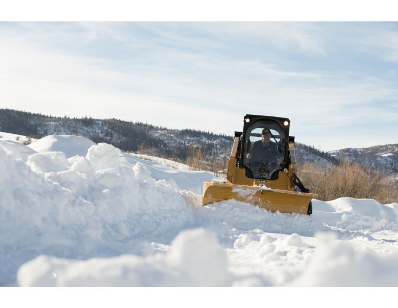Cat V-Plow Moving Snow In Angle Blade Setup