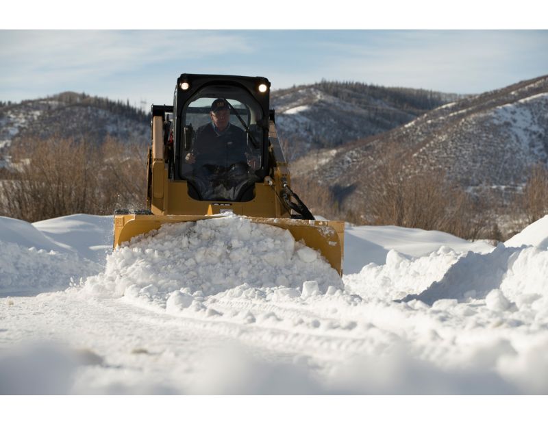 Cat V-Plow Pushing Snow in Scoop Setup