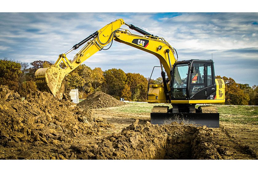 311F RR digging in trenching application with a General Duty Bucket