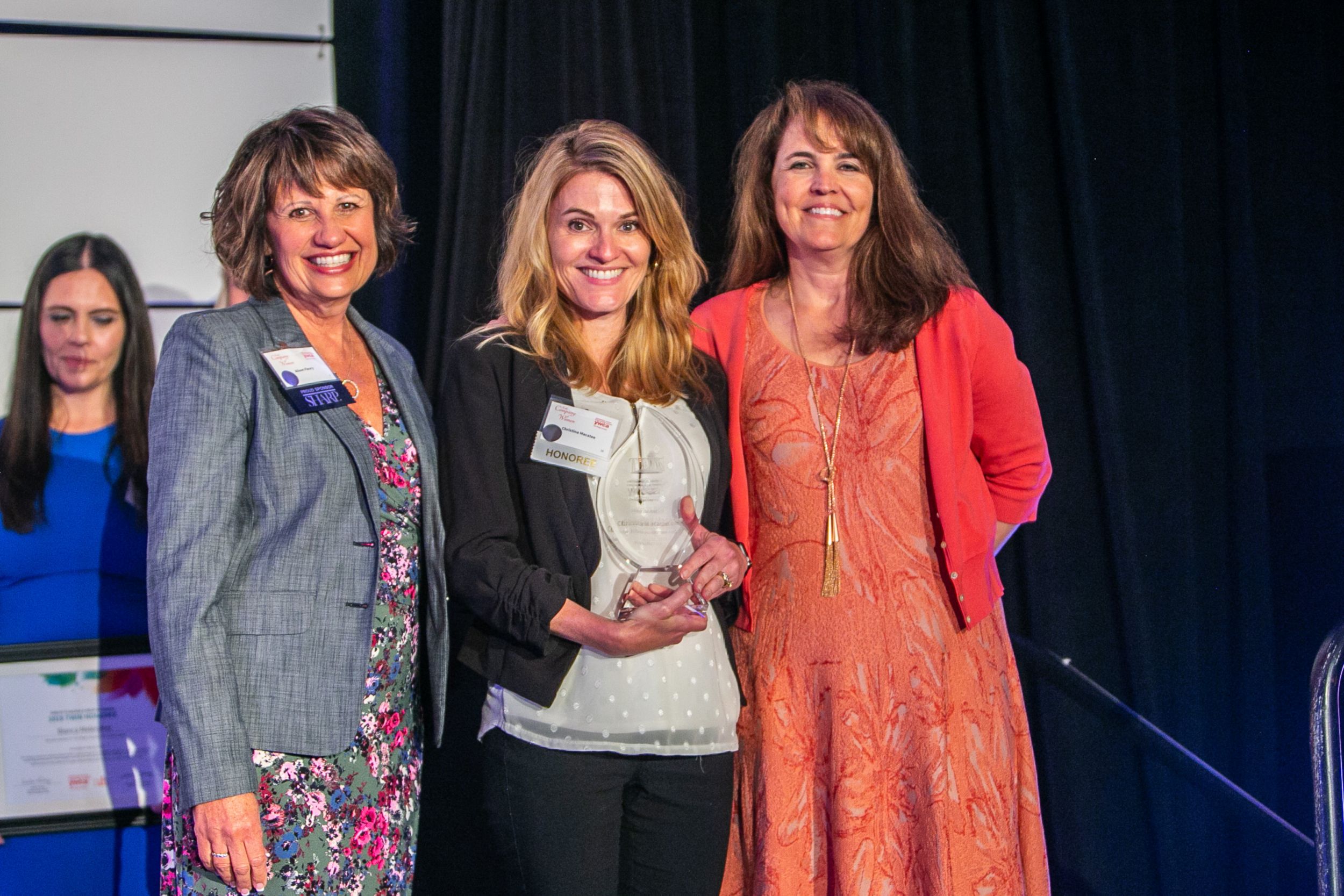 Christina Macatee accepting her Mentor Award trophy Solar Turbines