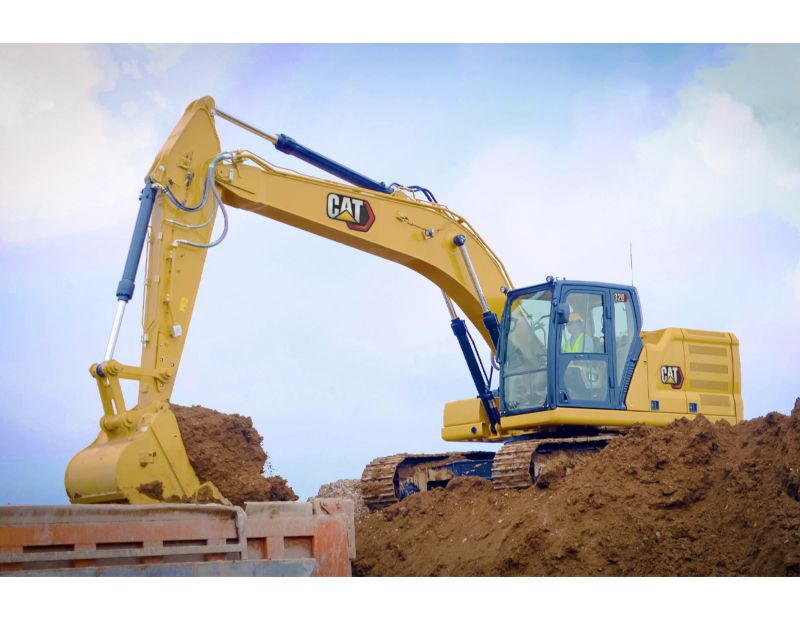 320 Medium Excavator using a General Duty Bucket to load a truck