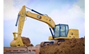 320 Medium Excavator using a General Duty Bucket to load a truck