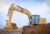 320 Medium Excavator using a General Duty Bucket to load a truck