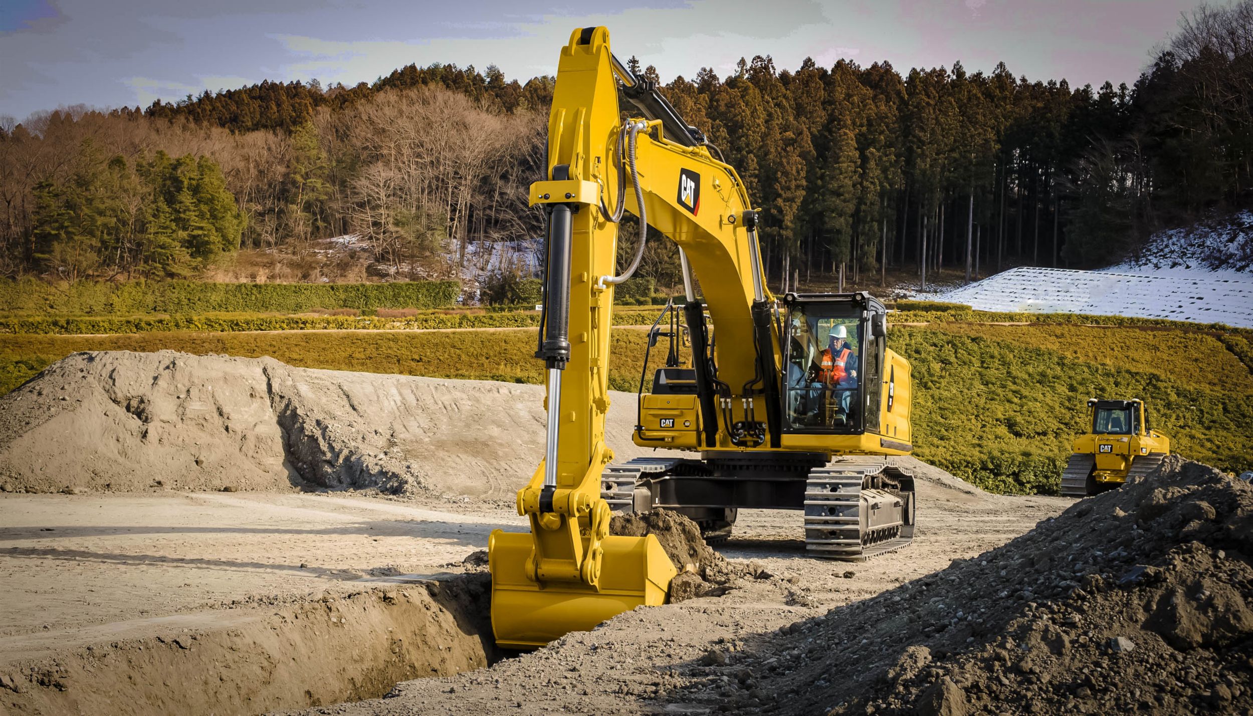 340 Hydraulic Excavator digging trench in rocky soil