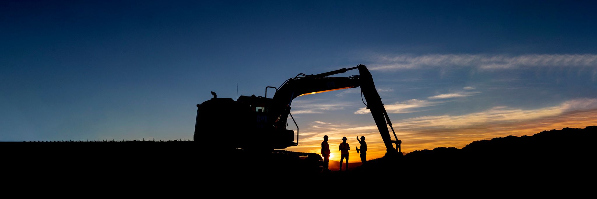 People on jobsite at sunrise