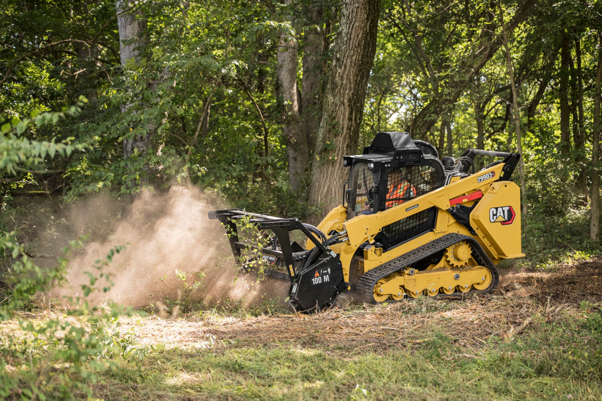 Compact track loader with mulcher attachment