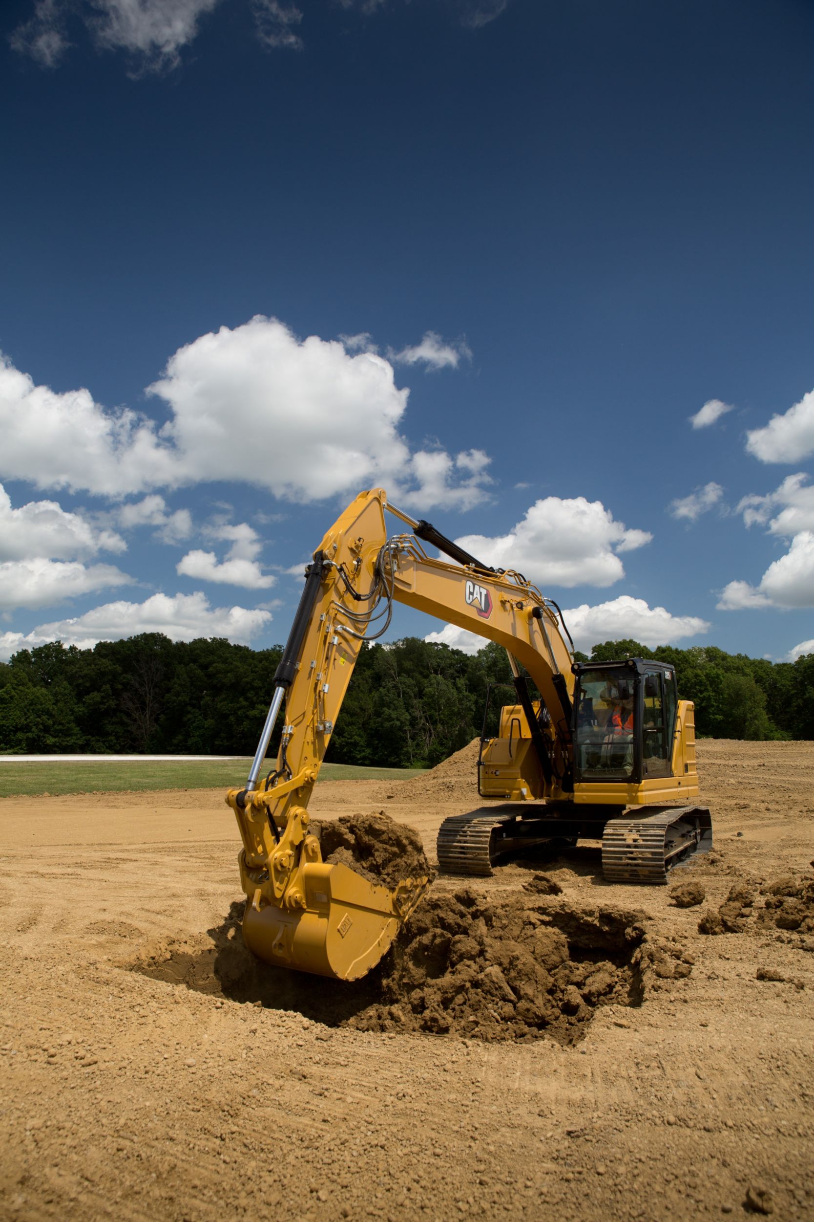 325 Hydraulic Excavator digging a basement