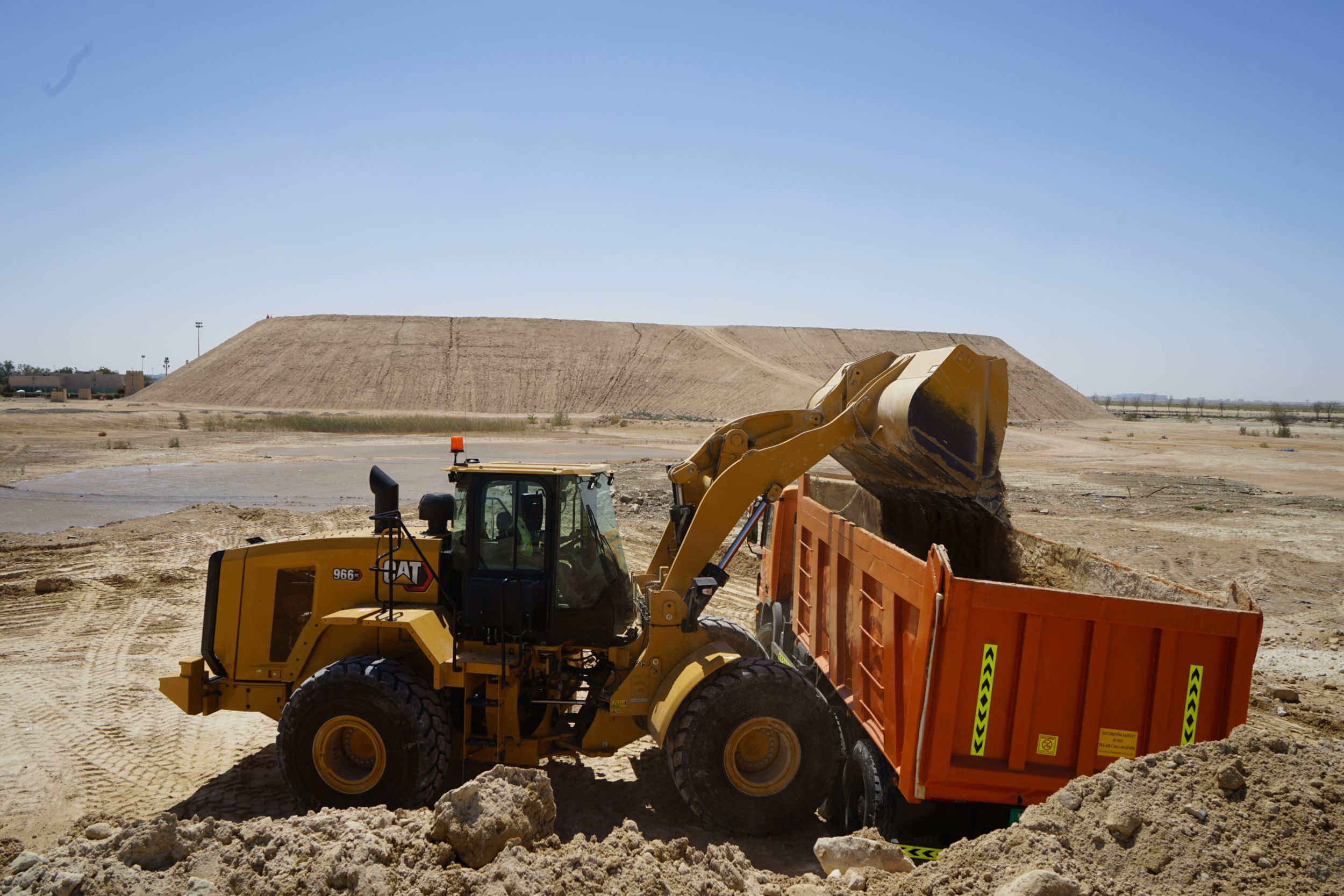 966 GC Medium Wheel Loader Loading a Truck