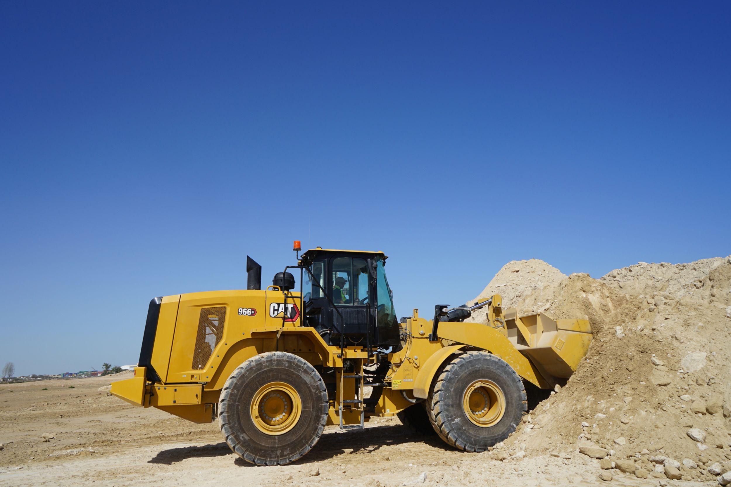 966 GC Medium Wheel Loader Scooping Dirt