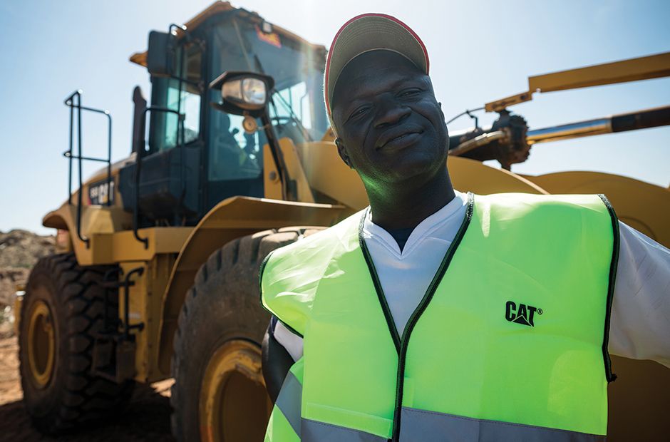 Technician in front of a wheel loader