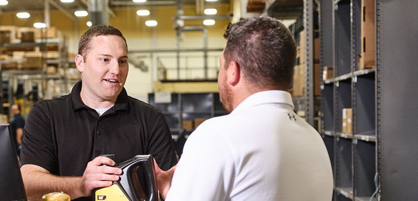 Dealer Helping a Customer