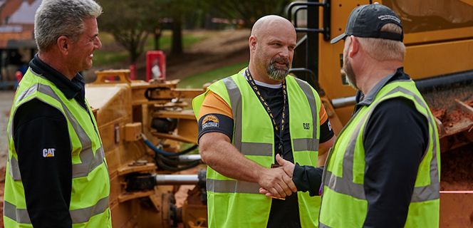 Workers shaking hands