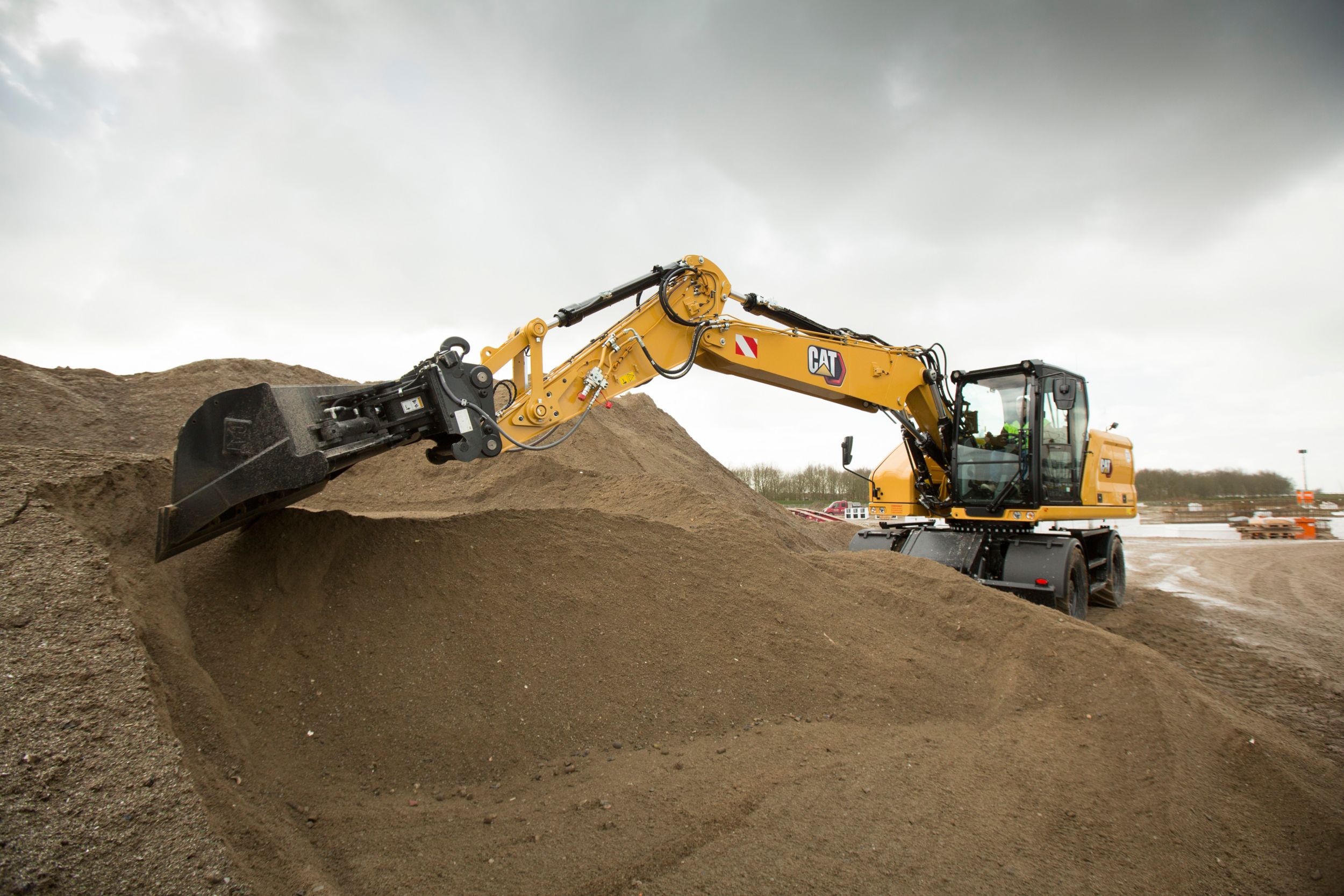 Efficiently dig with the M318 Wheeled Excavator