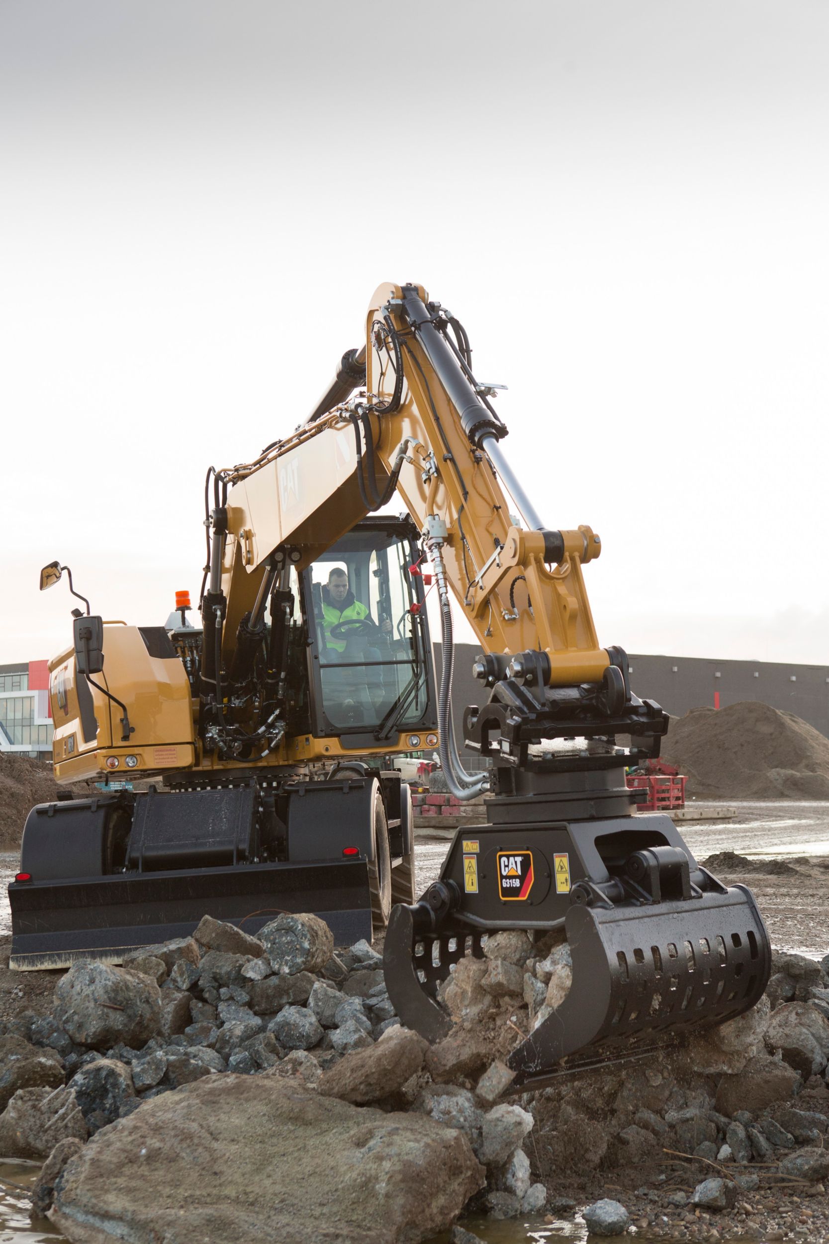 Tackle rocks with the grapple on the M318 Wheeled Excavator