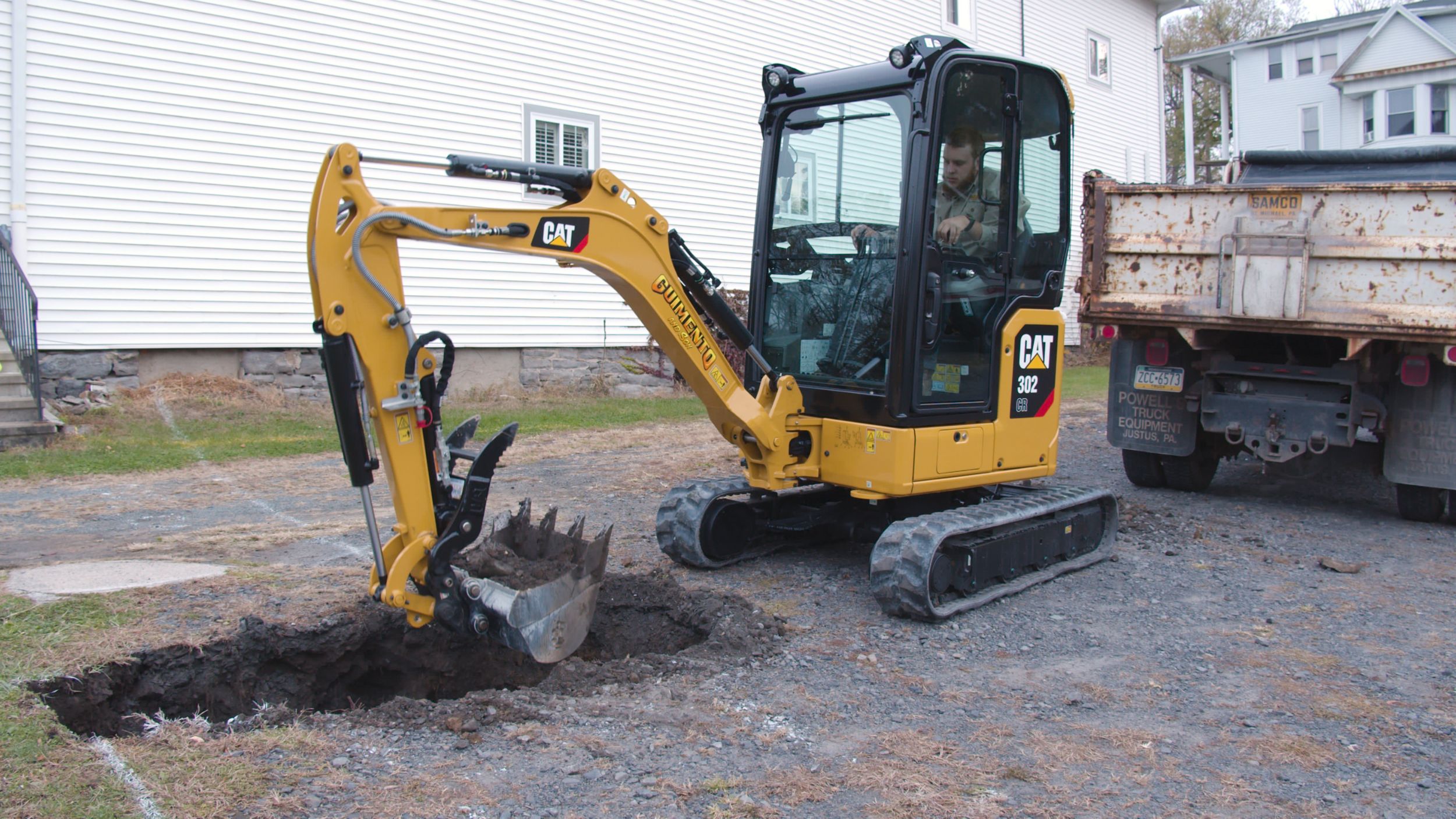 Hardscaper Guimento & Sons with Cat 302 Mini Excavator