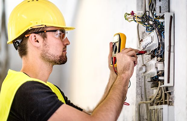 Electric Contractor testing an electrical panel