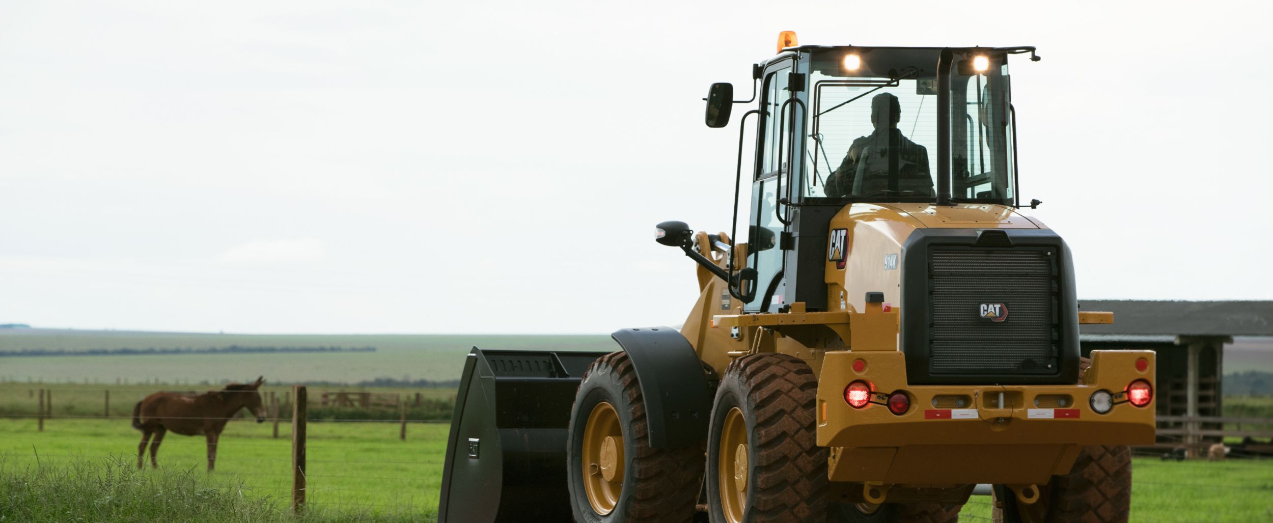 Customer looking towards his equipment on a jobsite during the COVID-19 pandemic