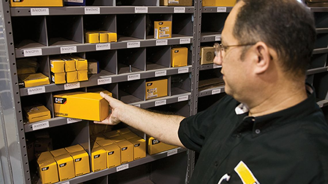 Dealer parts and service support team member finding parts