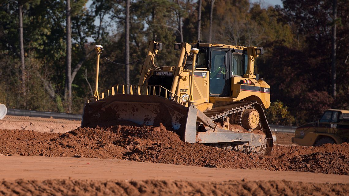 Two customers on jobsite in personal safety gear