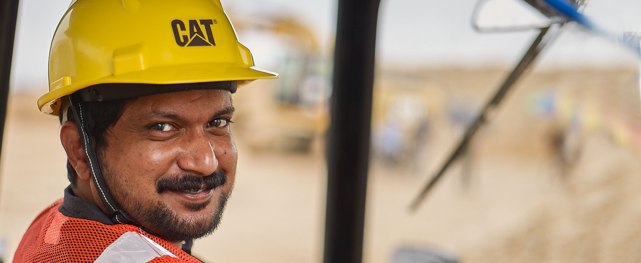 Younger male customer on a jobsite looking back