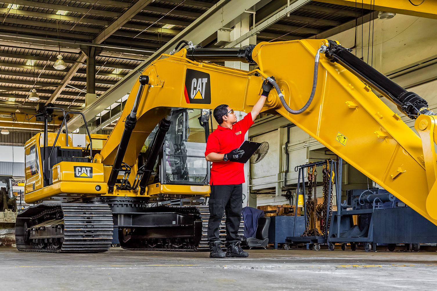 Younger male customer working on machine during pandemic
