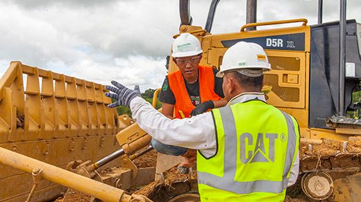 Dealer parts and service support team member explaining parts