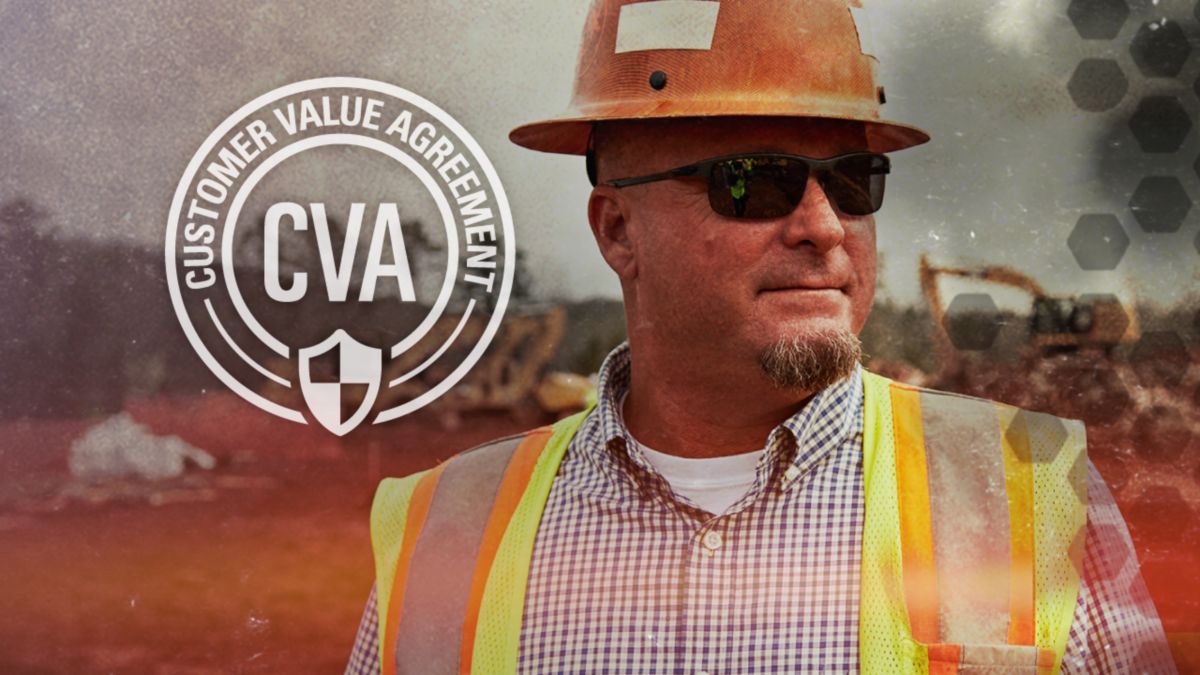 Cat worker wearing construction hat and sunglasses with CVA graphic in background