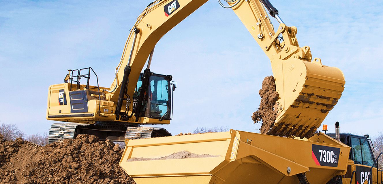 Excavator lifting dirt