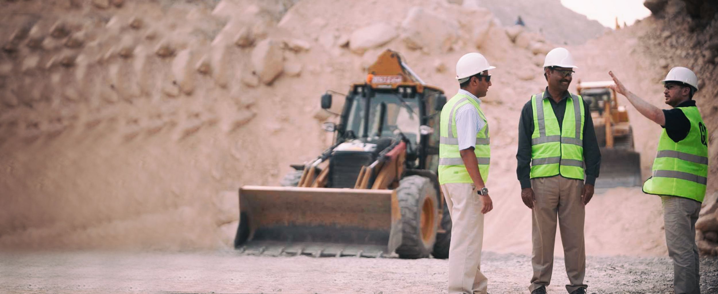 Customer looking towards his equipment on a jobsite during the COVID-19 pandemic