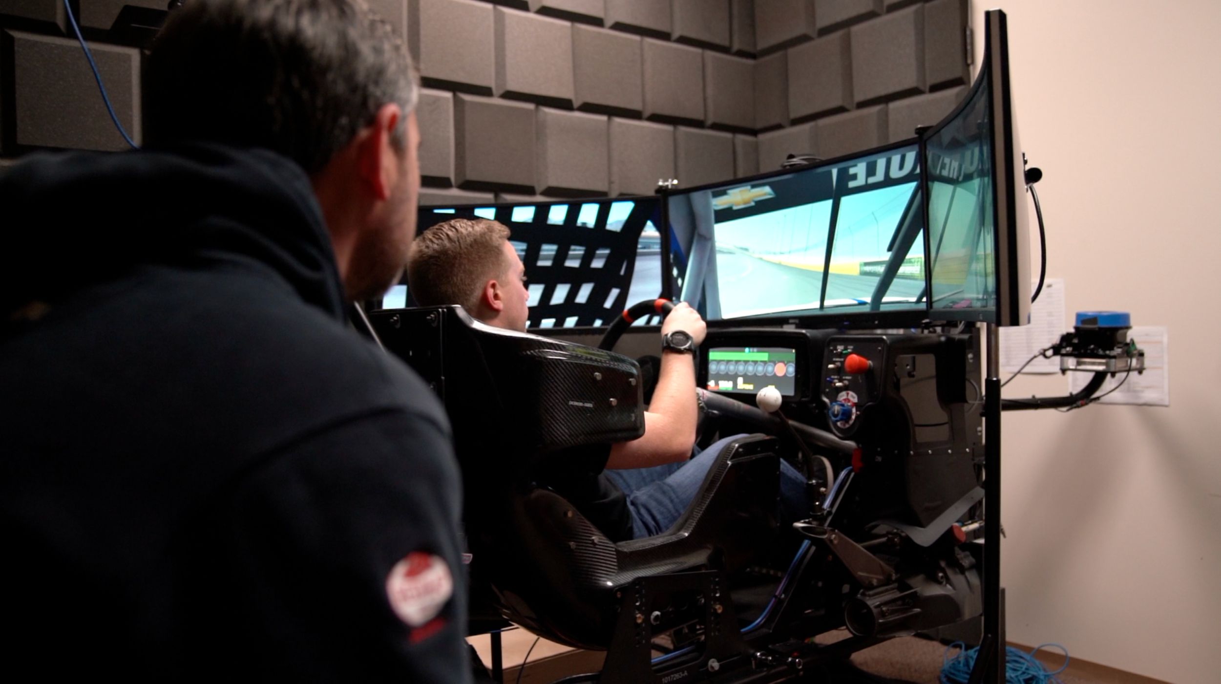 Crew Chief Randall Burnett gathering information as Driver Tyler Reddick spends time in the simulator. 