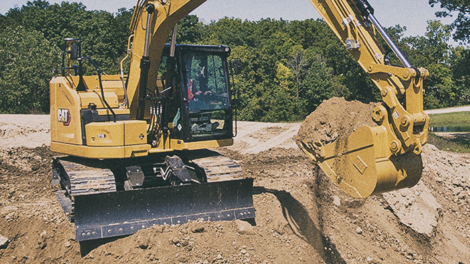 315 Excavator picking up dirt on jobsite