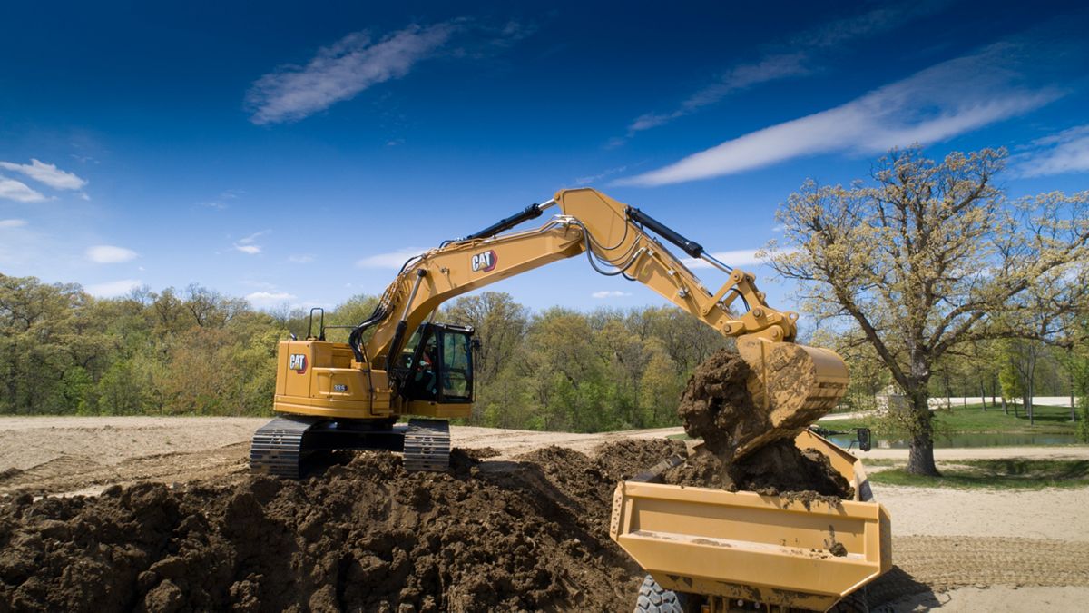 High Performance Truck Loading with a 335 Excavator