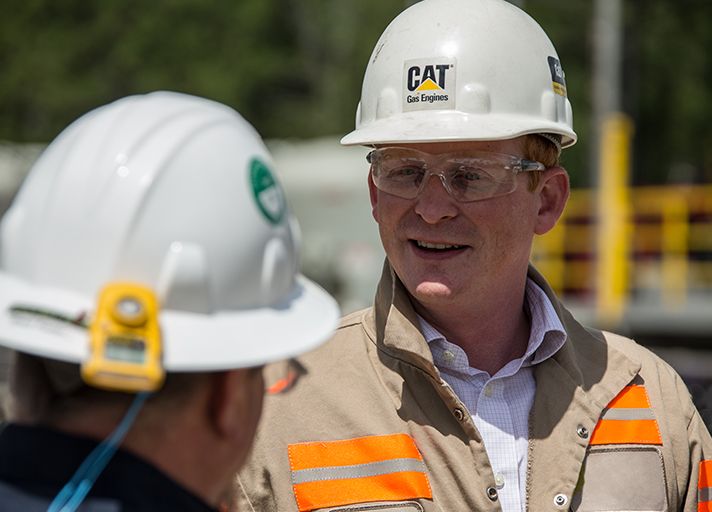 Caterpillar dealer talking with an Oilfield operator