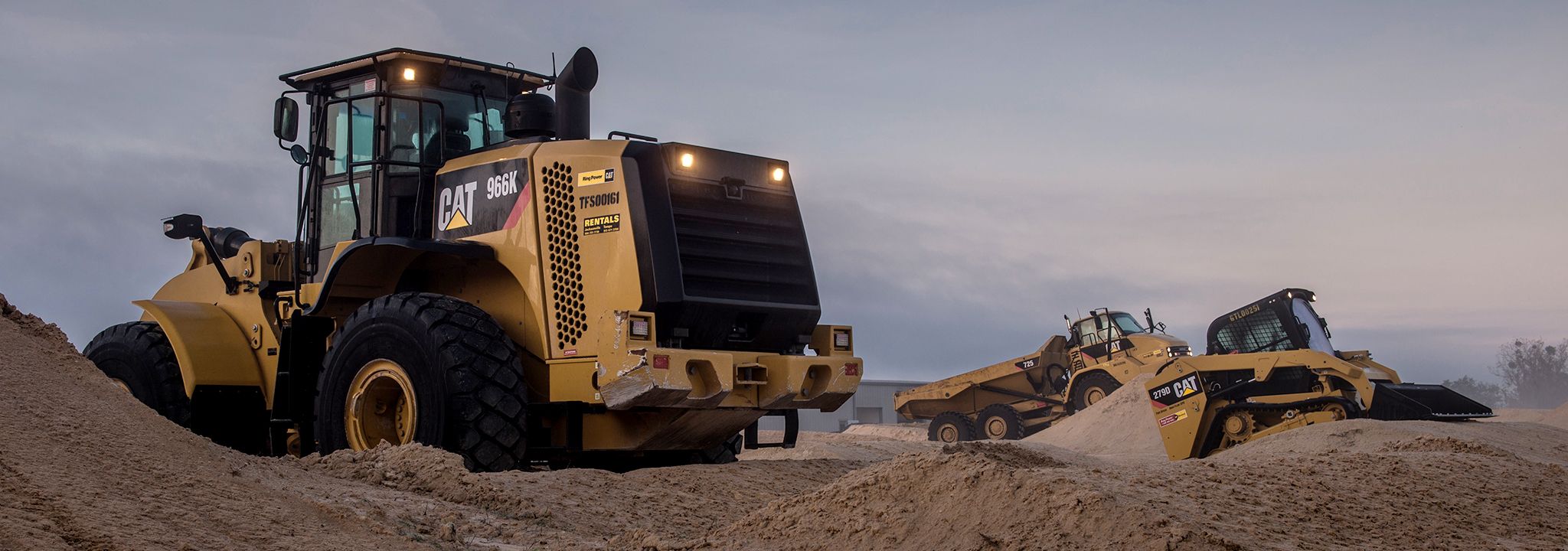 Wheel Loader, Skid Steer and Articulated Truck working on jobsite