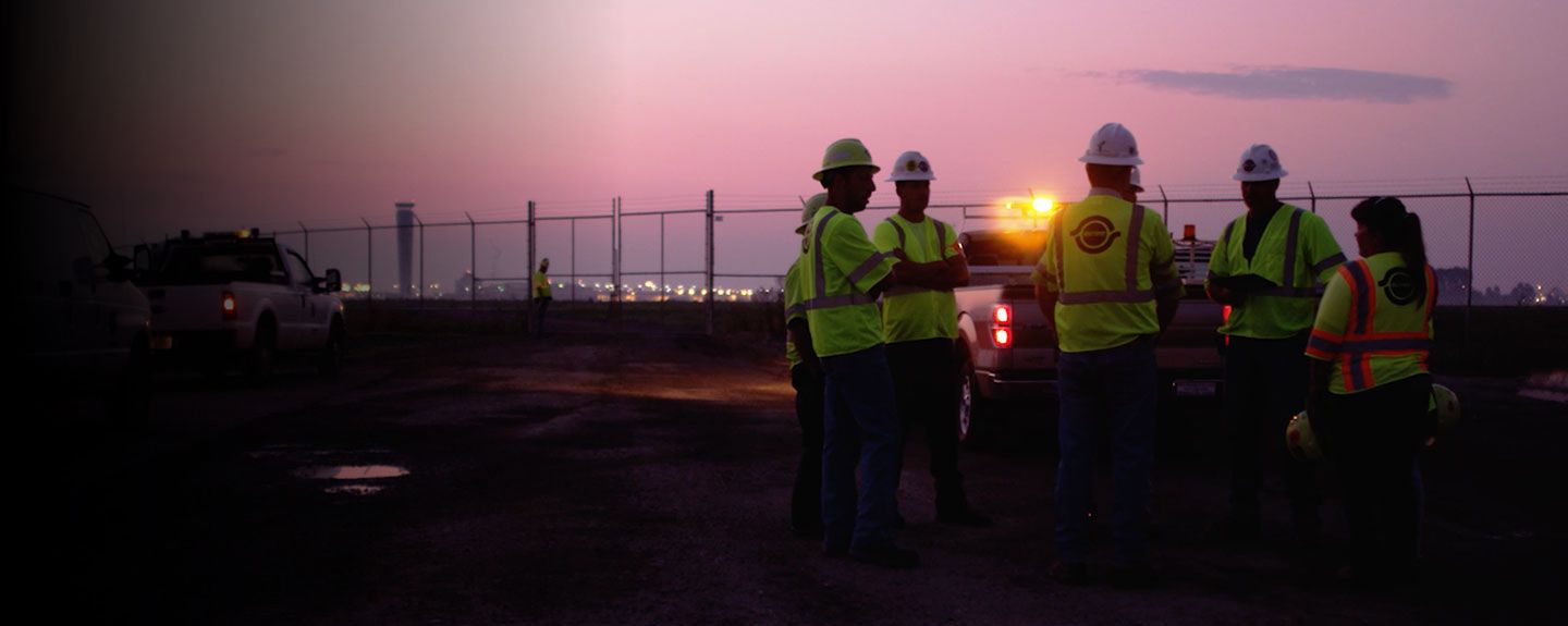 Train traveling across green fields