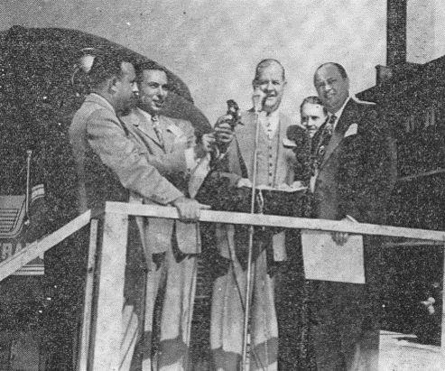 The new General motors Train of Tomorrow is in Springfield for public inspection. Approximately 140 guest of GM rode the train. GM received a special copy of a joint House-senate resolution commending the “Train of Tomorrow.” Regional director of PR for GM Osborn and state Sen. A.J. Bidwell made the presentation (left to right).