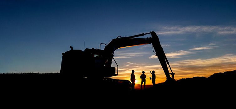 Excavator at sunrise