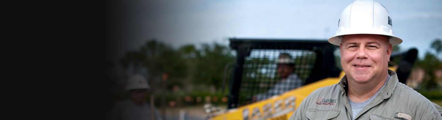 Man smiling on job site