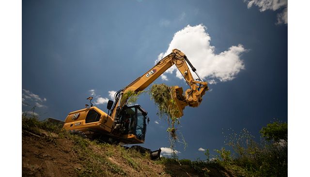 M320 working in a ditch
