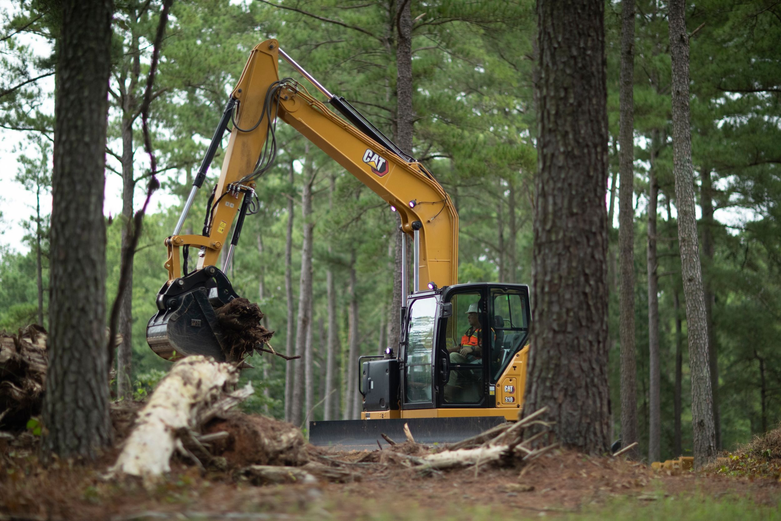 A Mini Excavator with tree mulch