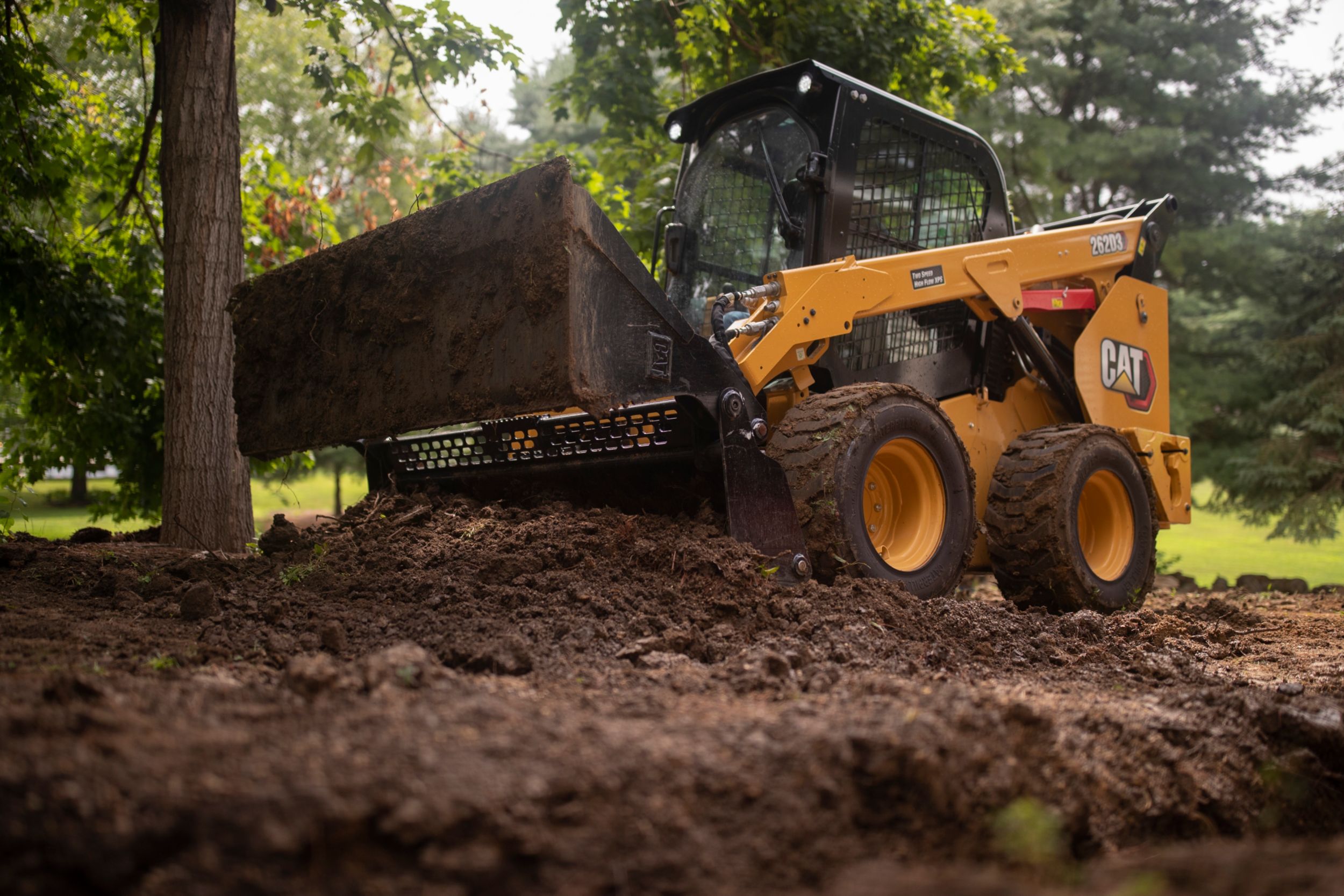 Skid Steer loader with bucket attachment