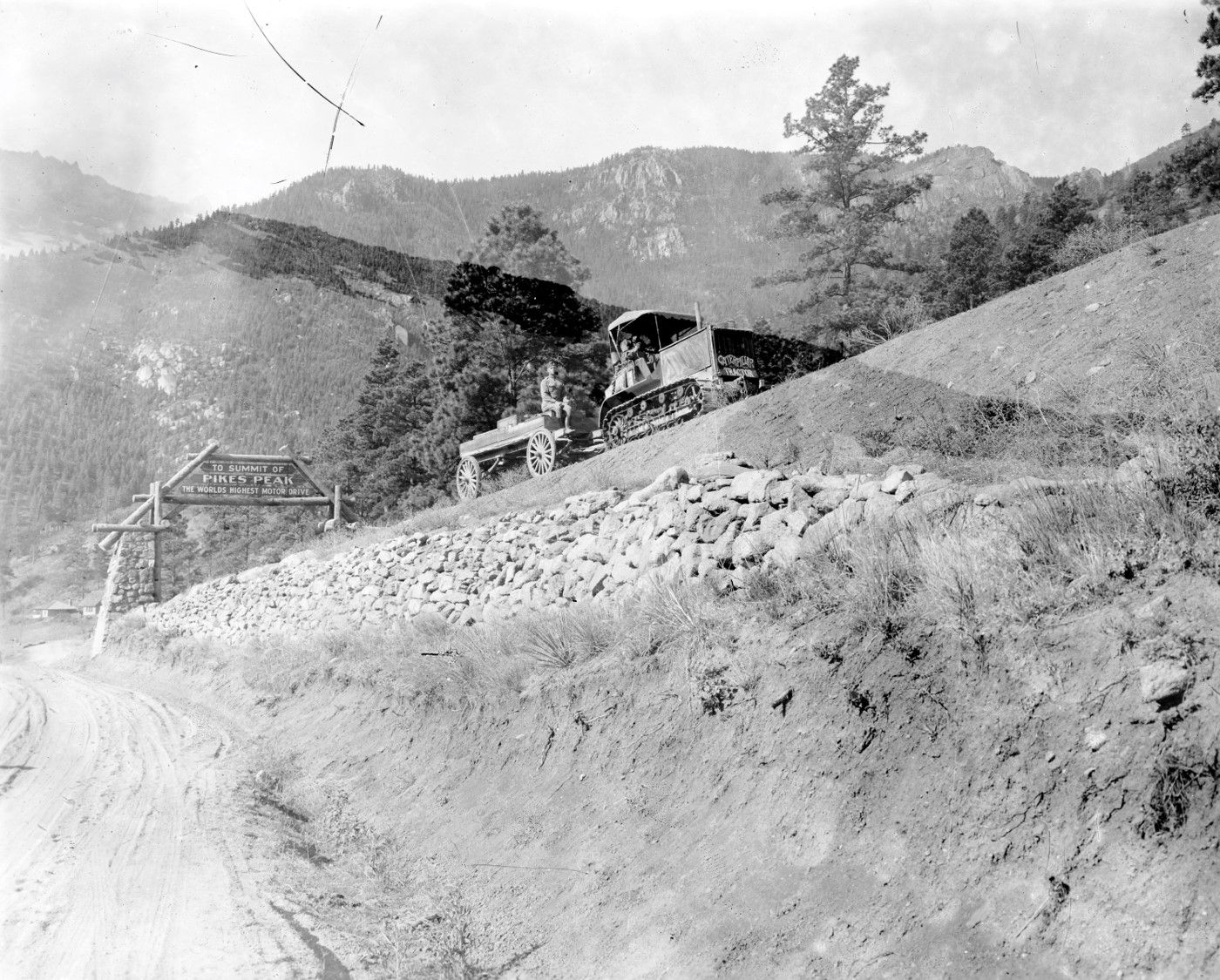 Up the spiraling 16-mile road to the peak, the Holt 5-Ton tractor climbed. Despite uncleared, snow-packed roads for the last two miles, the 5-Ton tractor made the ascent to the tip of the peak and came back down within one day.
