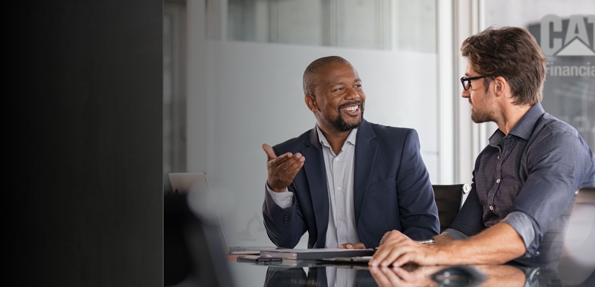 two well dressed men in business setting.
