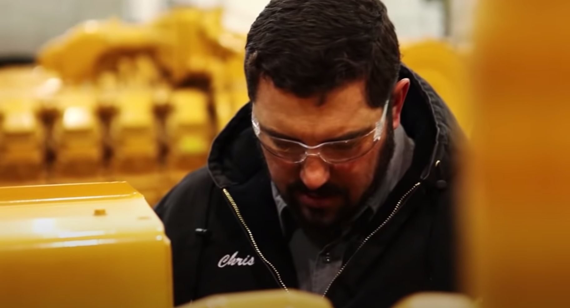 Technician Working On Machine Parts