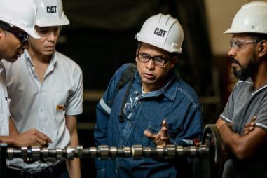 Group of Technicians Listening to Instructor