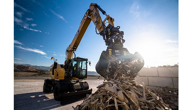 M319 with TRS and grapple picking up mixed debris