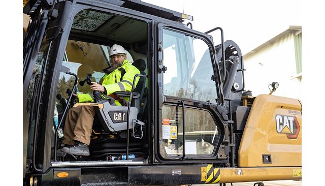 MH3022 operator looking comfortable in the cab