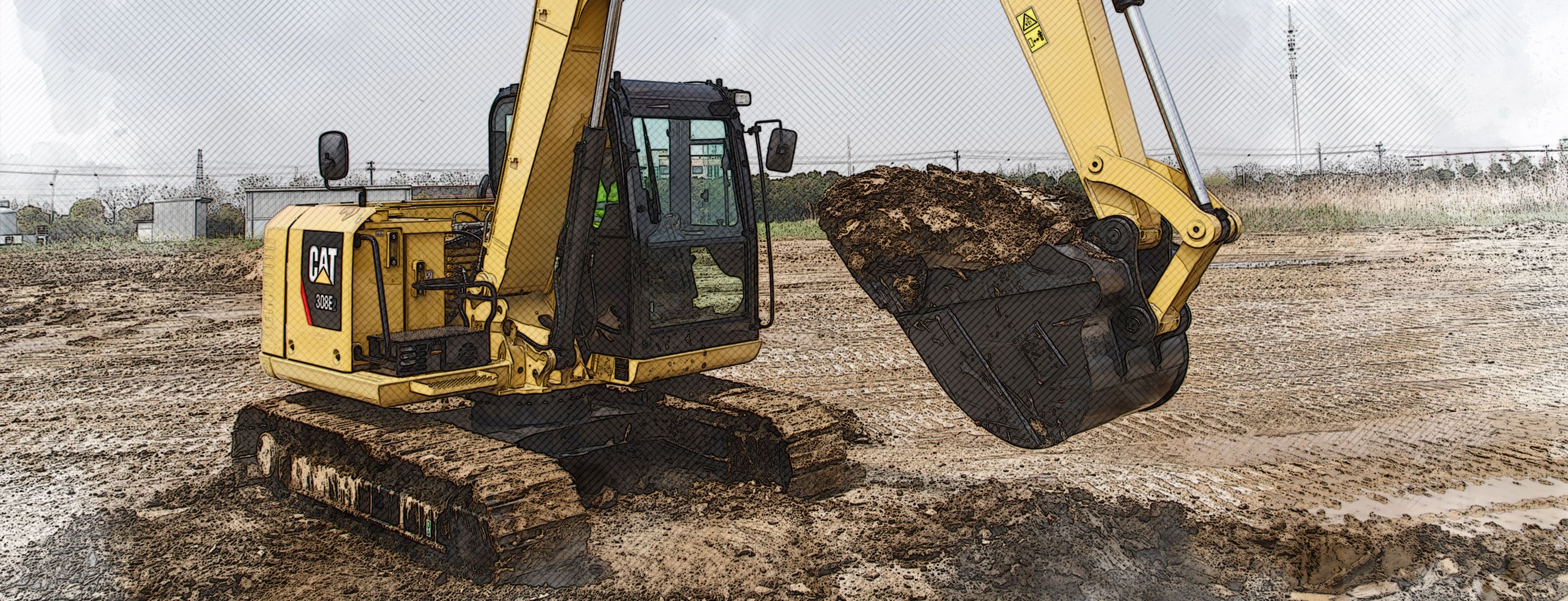 308E2 Excavator undercarriage in field