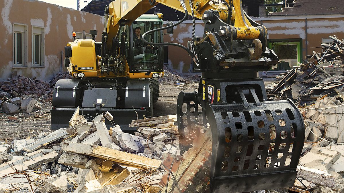 Cat machine doing demolition work